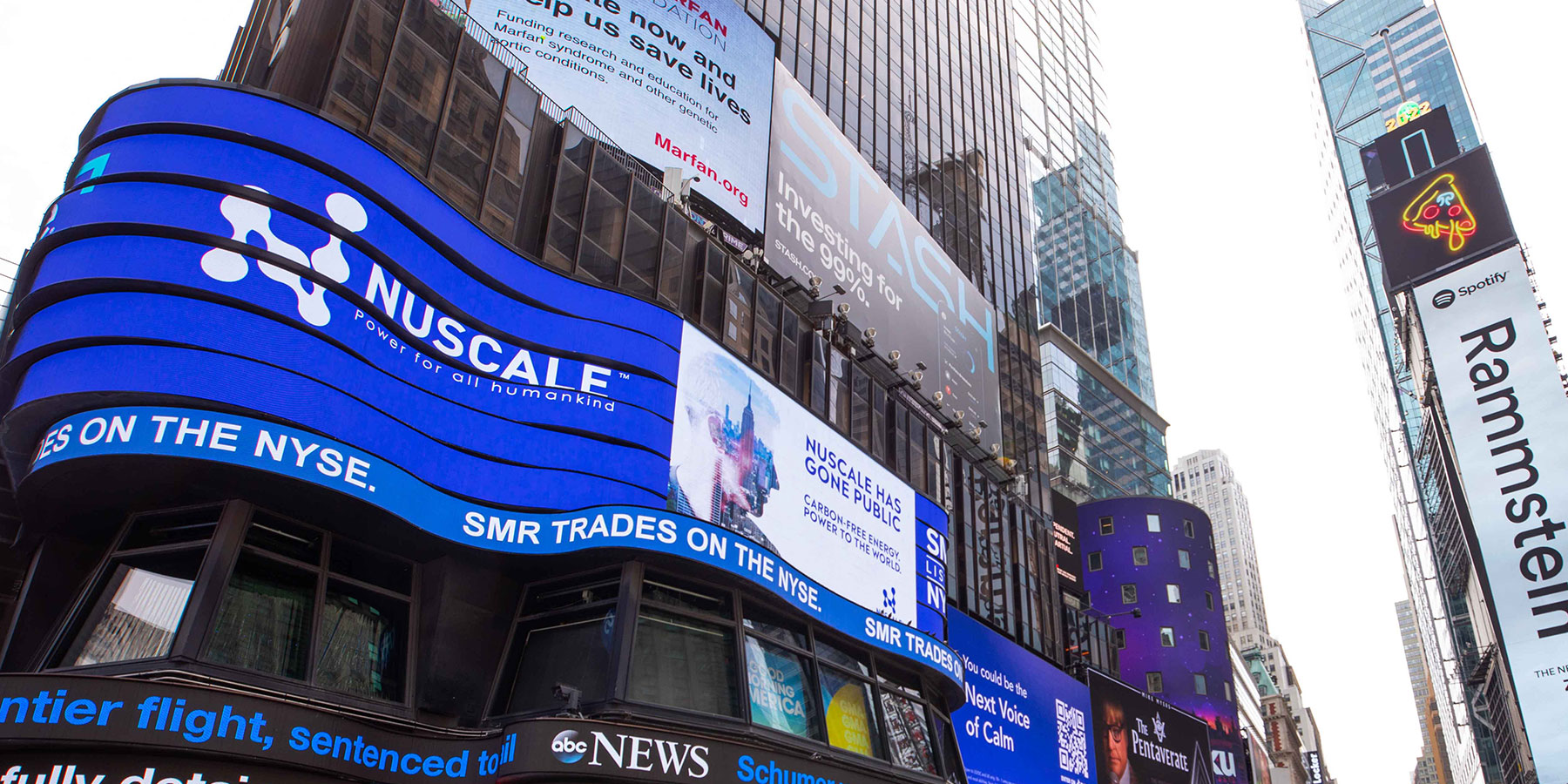 Exterior digital billbord displaying NuScale logo and going public announcement at NYSE. 