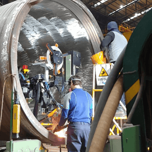 Workers in industrial setting.