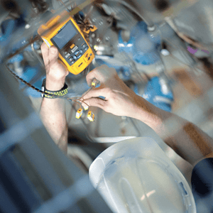 Overhead shot of NuScale worker using a device in industrial setting.